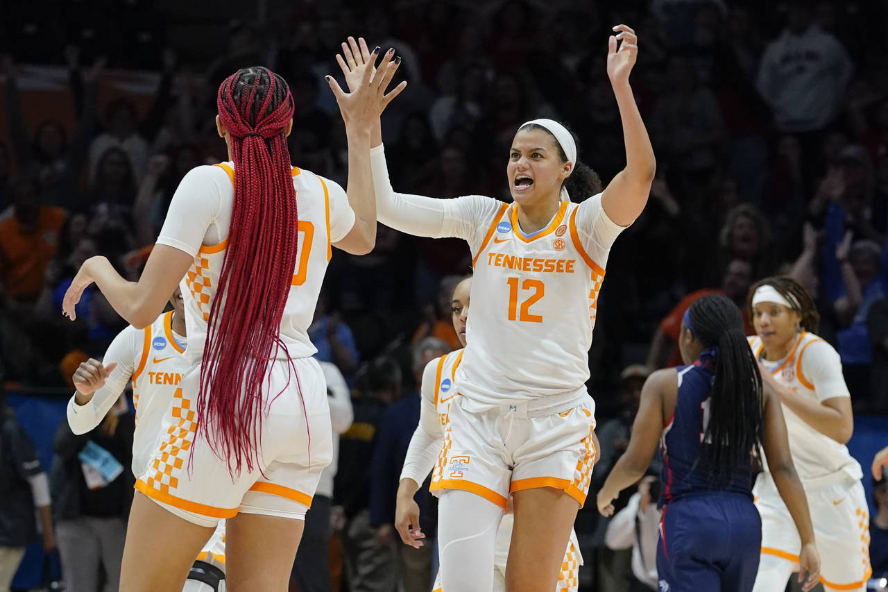 Tennessee's Rae Burrell (12) celebrates with Tamari Key (20) after Tennessee beat Belmont 70-67 in ...