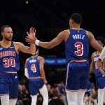 
              Golden State Warriors guard Stephen Curry (30) high-fives guard Jordan Poole (3) after a 3-pointer during the first half of an NBA basketball game against the Los Angeles Lakers in Los Angeles, Saturday, March 5, 2022. (AP Photo/Ashley Landis)
            