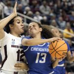 
              South Carolina guard Brea Beal (12) defends against Creighton guard Rachael Saunders (13) during the first half of a college basketball game in the Elite 8 round of the NCAA tournament in Greensboro, N.C., Sunday, March 27, 2022. (AP Photo/Gerry Broome)
            