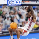 
              Houston guard Take Moore (4) dunks in the second half of an NCAA college basketball game against Tulane in the semifinals of the American Athletic Conference tournament in Fort Worth, Texas, Saturday, March 12, 2022. (AP Photo/Gareth Patterson)
            