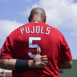 
              St. Louis Cardinals' Albert Pujols stands for the national anthem before a spring training baseball game against the Washington Nationals, Wednesday, March 30, 2022, in West Palm Beach, Fla. (AP Photo/Sue Ogrocki)
            