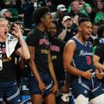 
              Richmond's Nick Sherod (5) celebrates with teammates in the second half of a college basketball game against the Iowa during the first round of the NCAA men's tournament, Thursday, March 17, 2022, in Buffalo, N.Y. (AP Photo/Frank Franklin II)
            