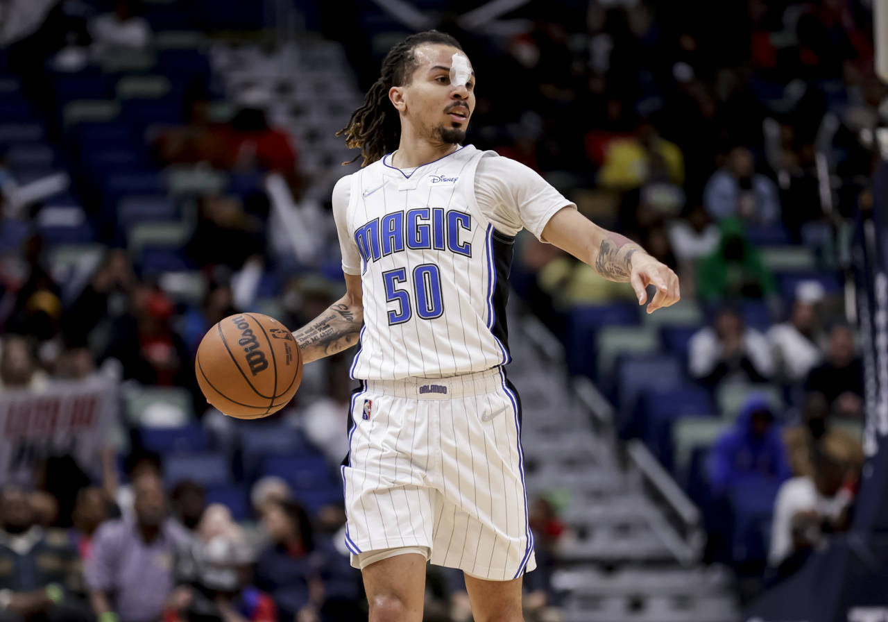 Orlando Magic guard Cole Anthony (50) brings the ball up against the New Orleans Pelicans during th...