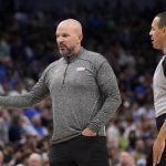 
              Dallas Maverick head coach Jason Kidd, left, talks with referee Curtis Blair, right, in the first half of an NBA basketball game against the Sacramento Kings in Dallas, Saturday, March, 5, 2022. (AP Photo/Tony Gutierrez)
            