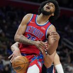 
              Detroit Pistons forward Marvin Bagley III (35) is fouled by Washington Wizards forward Anthony Gill during the first half of an NBA basketball game, Friday, March 25, 2022, in Detroit. (AP Photo/Carlos Osorio)
            
