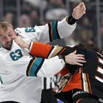 
              CORRECTS TO DUCKS CENTER SAM CARRICK, RIGHT, NOT LEFT - Anaheim Ducks center Sam Carrick, right, and San Jose Sharks left wing Jeffrey Viel fight during the first period of an NHL hockey game Sunday, March 6, 2022, in Anaheim, Calif. (AP Photo/Mark J. Terrill)
            