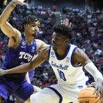 
              Seton Hall forward Alexis Yetna (10) drives around TCU guard Micah Peavy, left, during the first half of a first-round NCAA college basketball tournament game, Friday, March 18, 2022, in San Diego. (AP Photo/Denis Poroy)
            