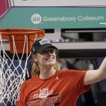 
              North Carolina State center and most valuable player Elissa Cunane cuts the net following an NCAA college basketball championship game against Miami at the Atlantic Coast Conference women's tournament in Greensboro, N.C., Sunday, March 6, 2022. (AP Photo/Gerry Broome)
            