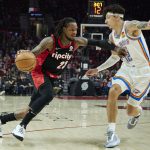
              Portland Trail Blazers guard Ben McLemore, left, dribbles around Oklahoma City Thunder forward Lindy Waters III during the first half of an NBA basketball game in Portland, Ore., Monday, March 28, 2022. (AP Photo/Craig Mitchelldyer)
            