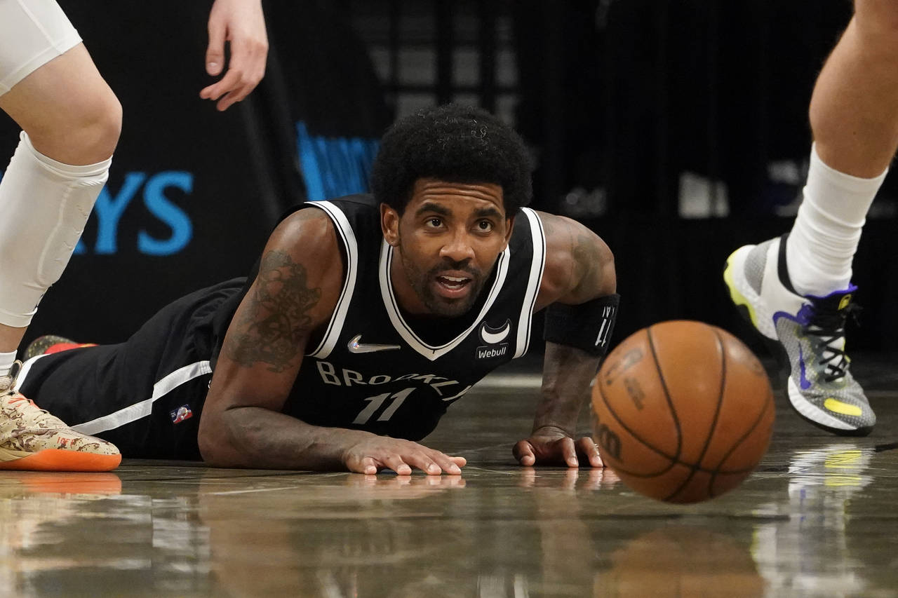 Brooklyn Nets guard Kyrie Irving (11) loses control of the ball on a drive to the net in the second...