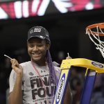 
              South Carolina forward Aliyah Boston (4) reacts after cutting the net following a college basketball game against Creighton in the Elite 8 round of the NCAA tournament in Greensboro, N.C., Sunday, March 27, 2022. (AP Photo/Gerry Broome)
            