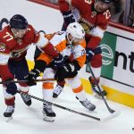 
              Florida Panthers centers Frank Vatrano (77) and Carter Verhaeghe (23) and Philadelphia Flyers center Claude Giroux (28) go after the puck during the second period of an NHL hockey game Thursday, March 10, 2022, in Sunrise, Fla. (AP Photo/Marta Lavandier)
            