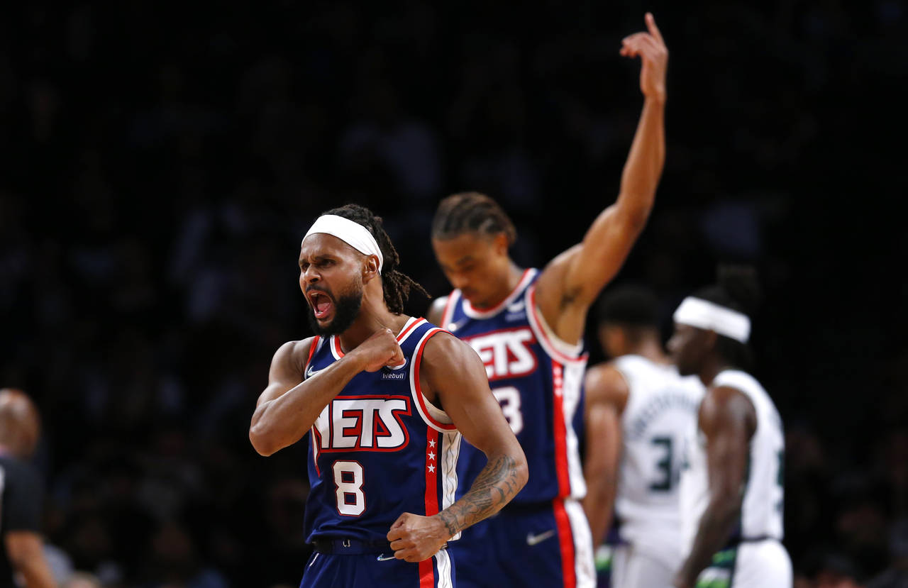 Brooklyn Nets guard Patty Mills (8) reacts after making a 3-point shot against the Milwaukee Bucks ...