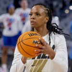 
              UCF guard Diamond Battles warms up ahead of an NCAA college basketball semifinal round game against SMU at the women's American Athletic Conference tournament in Fort Worth, Texas, Wednesday, March 9, 2022. (AP Photo/Gareth Patterson)
            