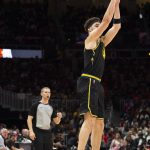 
              Golden State Warriors guard Klay Thompson (11) shoots a 3-point basket during the second half of an NBA basketball game against the Atlanta Hawks, Friday, March 25, 2022, in Atlanta. (AP Photo/Hakim Wright Sr.)
            