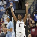 
              South Carolina forward Aliyah Boston (4) reacts while North Carolina guard Kennedy Todd-Williams, left, looks away following a college basketball game in the Sweet 16 round of the NCAA tournament in Greensboro, N.C., Friday, March 25, 2022. (AP Photo/Gerry Broome)
            