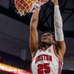 
              Houston forward Josh Carlton (25) dunks in the first half of an NCAA college basketball game against Tulane in the semifinals of the American Athletic Conference tournament in Fort Worth, Texas, Saturday, March 12, 2022. (AP Photo/Gareth Patterson)
            