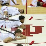 
              Indiana and Rutgers players stretch on the court before an NCAA college basketball game, Wednesday, March 2, 2022, in Bloomington, Ind. (AP Photo/Doug McSchooler)
            