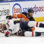 
              Washington Capitals Tom Wilson (43) reacts after a hit from Edmonton Oilers Darnell Nurse (25) during the first period of an NHL hockey game Wednesday, March 9, 2022 in Edmonton, Alberta.(Amber Bracken/The Canadian Press via AP)
            