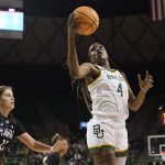 
              Baylor center Queen Egbo (4) grabs the ball against Hawaii forward Kallin Spiller (11) during the first half of a college basketball game in the first round of the NCAA tournament in Waco, Texas, Friday, March 18, 2022. (AP Photo/LM Otero)
            
