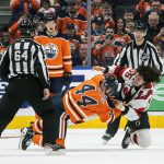 
              New Jersey Devils' Mason Geertsen (55) and Edmonton Oilers' Zack Kassian (44) fight during the second period of an NHL hockey game in Edmonton, Alberta, Saturday, March 19, 2022. (Jason Franson/The Canadian Press via AP)
            