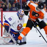 
              Philadelphia Flyers' James van Riemsdyk, right, tries to deflect a shot past New York Islanders' Ilya Sorokin during the second period of an NHL hockey game, Sunday, March 20, 2022, in Philadelphia. (AP Photo/Matt Slocum)
            