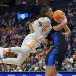 
              Tennessee's Alexus Dye, left, fouls Kentucky's Treasure Hunt (12) in the second half of an NCAA college basketball semifinal round game at the women's Southeastern Conference tournament Saturday, March 5, 2022, in Nashville, Tenn. Kentucky won 83-74. (AP Photo/Mark Humphrey)
            