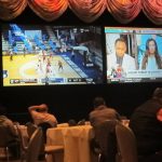 
              Customers watch a game in the NCAA basketball March Madness tournament on March 19, 2021, at the Borgata casino in Atlantic City, N.J. On March 13, 2022, the American Gaming Association predicted that 45 million Americans will bet on this year's tournament. (AP Photo/Wayne Parry)
            