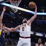 
              Cleveland Cavaliers forward Kevin Love (0) grabs a rebound over Indiana Pacers guard Chris Duarte (3) during the first half of an NBA basketball game in Indianapolis, Tuesday, March 8, 2022. (AP Photo/Michael Conroy)
            