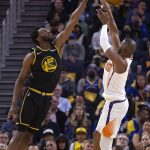 
              Golden State Warriors forward Andrew Wiggins (22) deflects a shot by Phoenix Suns guard Chris Paul (3) during the first quarter of an NBA basketball game Wednesday, March 30, 2022, in San Francisco. (AP Photo/D. Ross Cameron)
            
