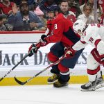 
              Washington Capitals left wing Alex Ovechkin (8) skates with the puck as Carolina Hurricanes defenseman Brady Skjei (76) defends in the first period of an NHL hockey game, Monday, March 28, 2022, in Washington. (AP Photo/Alex Brandon)
            