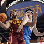 
              Southern California forward Isaiah Mobley, left, and UCLA guard Jaime Jaquez Jr. go after a rebound during the second half of an NCAA college basketball game Saturday, March 5, 2022, in Los Angeles. UCLA won 75-68. (AP Photo/Mark J. Terrill)
            