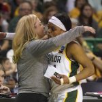 
              Baylor guard Sarah Andrews, right, gets a hug from head coach Nicki Collen after Andrews fouled out in the final minutes of the second half of a college basketball game against South Dakota in the second round of the NCAA tournament in Waco, Texas, Sunday, March 20, 2022.  (AP Photo/LM Otero)
            