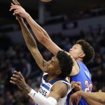 
              Oklahoma City Thunder forward Isaiah Roby (22) and Minnesota Timberwolves forward Jaden McDaniels (3) vie for a rebound during the first half of an NBA basketball game Wednesday, March 9, 2022, in Minneapolis. (AP Photo/Andy Clayton-King)
            