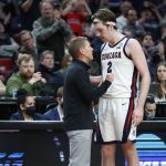 
              Gonzaga head coach Mark Few, left, talks with Gonzaga forward Drew Timme (2) as Timme leaves the game against Georgia State during the second half of a first round NCAA college basketball tournament game, Thursday, March 17, 2022, in Portland, Ore. (AP Photo/Craig Mitchelldyer)
            