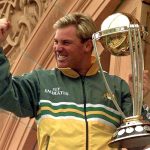 
              FILE - Australia's Shane Warne clenches his fist as he holds the Cricket World Cup Trophy on the team balcony at Lords after Australia defeated Pakistan by 8 wickets in the final of the Cricket World Cup, in London Sunday, June 20, 1999. Shane Warne, one of the greatest cricket players in history, has died. He was 52. Fox Sports television, which employed Warne as a commentator, quoted a family statement as saying he died of a suspected heart attack in Koh Samui, Thailand. (AP Photo/Rui Vieira, File)
            