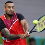 
              Nick Kyrgios, of Australia, returns a shot from Andrey Rublev, of Russia, during the Miami Open tennis tournament, Friday, March 25, 2022, in Miami Gardens, Fla. (AP Photo/Wilfredo Lee)
            