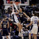 
              Orlando Magic forward Franz Wagner (22) shoots against New Orleans Pelicans center Jaxson Hayes (10) during the second quarter of an NBA basketball game in New Orleans, Wednesday, March 9, 2022. (AP Photo/Derick Hingle)
            