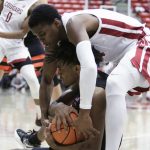 
              Washington State guard Noah Williams, top, ties up Oregon State forward Glenn Taylor Jr. during the second half of an NCAA college basketball game Thursday, March 3, 2022, in Pullman, Wash. Washington State won 71-67. (AP Photo/Young Kwak)
            