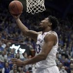 
              Kansas forward David McCormack (33) puts up a shot during the first half of an NCAA college basketball game against TCU Thursday, March 3, 2022, in Lawrence, Kan. (AP Photo/Charlie Riedel)
            