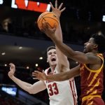 
              Wisconsin's Chris Vogt blocks the shot of Iowa State's Tyrese Hunter during the first half of a second-round NCAA college basketball tournament game Sunday, March 20, 2022, in Milwaukee. (AP Photo/Morry Gash)
            