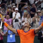 
              Rafael Nadal, of Spain, celebrates after defeating Carlos Alcaraz, of Spain, during the men's singles semifinals at the BNP Paribas Open tennis tournament Saturday, March 19, 2022, in Indian Wells, Calif. Nadal won 6-4, 4-6, 6-3. (AP Photo/Mark J. Terrill)
            