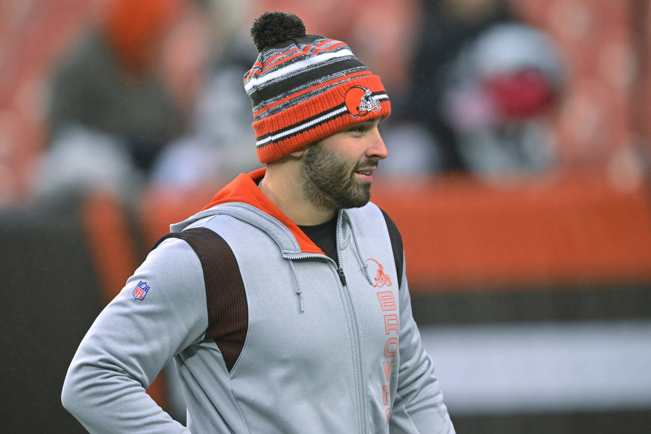 FILE - Cleveland Browns quarterback Baker Mayfield watches teammates warm up for an NFL football ga...