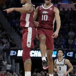 
              Arkansas guard Au'Diese Toney, left, celebrates with forward Jaylin Williams (10) during the second half of a college basketball game against Gonzaga in the Sweet 16 round of the NCAA tournament in San Francisco, Thursday, March 24, 2022. (AP Photo/Tony Avelar)
            