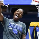 
              Kentucky's Dre'una Edwards cuts the net after Kentucky beat South Carolina in the NCAA women's college basketball Southeastern Conference tournament championship game Sunday, March 6, 2022, in Nashville, Tenn. Edwards hit the winning shot in Kentucky's 64-62 win. (AP Photo/Mark Humphrey)
            