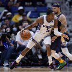 
              Sacramento Kings guard De'Aaron Fox (5) drives to the basket against New Orleans Pelicans guard Jose Alvarado in the second half of an NBA basketball game in New Orleans, Wednesday, March 2, 2022. The Pelicans won 125-95. (AP Photo/Gerald Herbert)
            