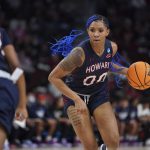 
              Howard forward Anzhane' Hutton dribbles the ball during the first half of a first-round game against South Carolina in the NCAA women's college basketball tournament Friday, March 18, 2022 in Columbia, S.C. (AP Photo/Sean Rayford)
            