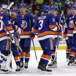 
              New York Islanders goaltender Ilya Sorokin (30) is congratulated by teammates after defeating the Anaheim Ducks in an NHL hockey game Sunday, March 13, 2022, in Elmont, N.Y. (AP Photo/Adam Hunger)
            