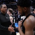 
              Providence head coach Ed Cooley consoles Al Durham after a college basketball game against Kansas in the Sweet 16 round of the NCAA tournament Friday, March 25, 2022, in Chicago. Kansas won 66-61. (AP Photo/Charles Rex Arbogast)
            