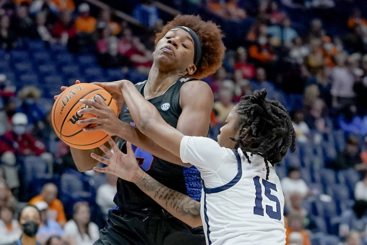 Florida's Nina Rickards, left, drives against Mississippi's Angel Baker (15) in the first half of a...